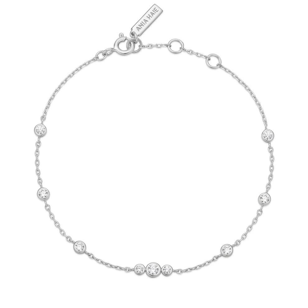 Niche Jewellery Ania Haie silver station bracelet with bezel-set cubic zirconia stones on a delicate chain.