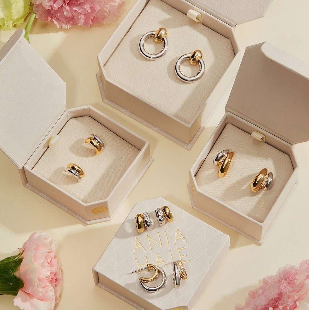 Niche Jewellery Ania Haie two-tone gold and silver hoop earrings with cubic zirconia in branded gift boxes.