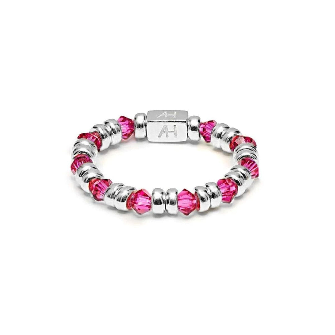 Niche Jewellery Annie Haak Joy ring featuring cerise pink crystals and 925 sterling silver beads with AH logo charm.