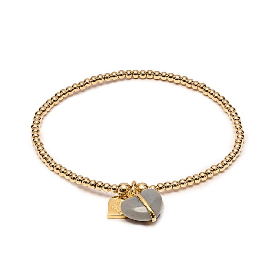 Niche Jewellery Annie Haak gold filled beaded stretch bracelet with a grey heart charm and engraved gold heart tag.