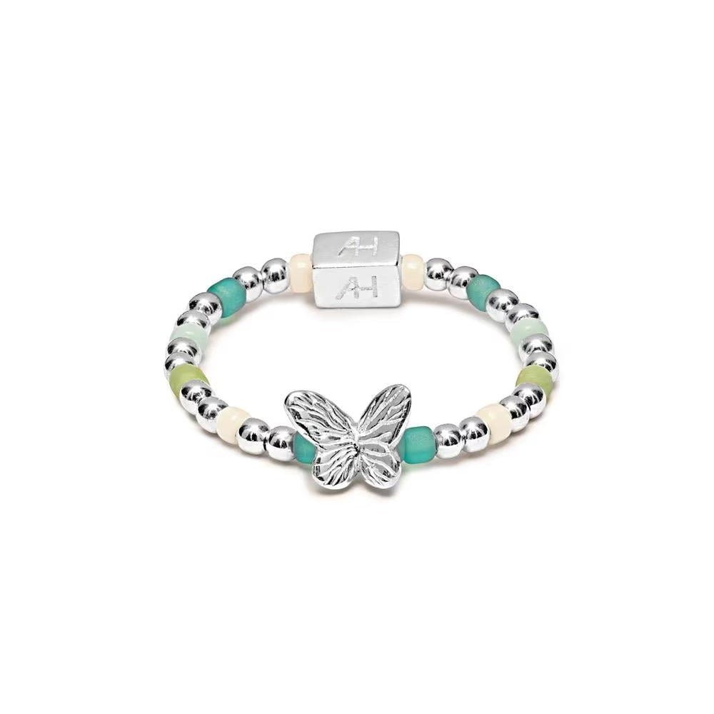 Niche Jewellery Annie Haak Papillon ring featuring turquoise and green beads with a sterling silver butterfly charm.