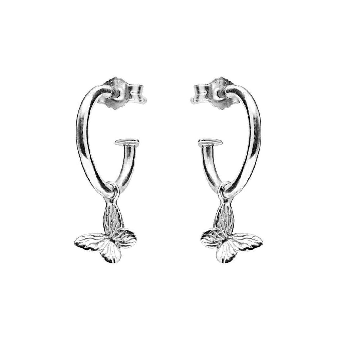 Niche Jewellery Annie Haak sterling silver hoop earrings featuring delicate butterfly charms on a white background.