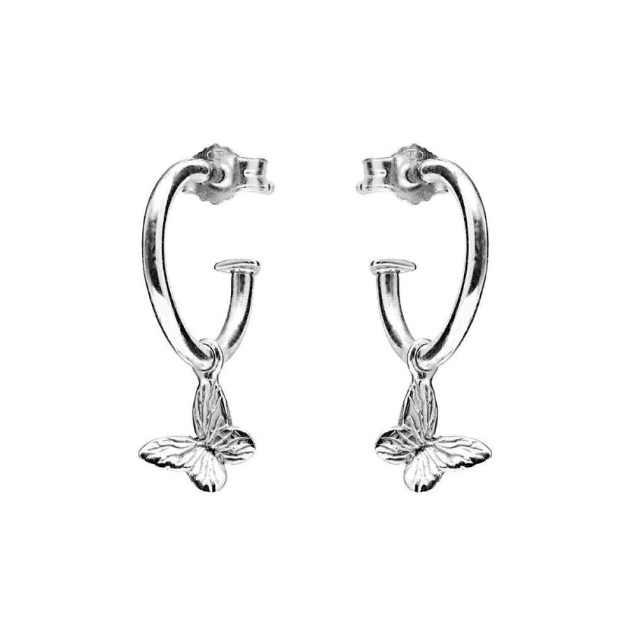 Niche Jewellery Annie Haak sterling silver hoop earrings featuring delicate butterfly charms on a white background.