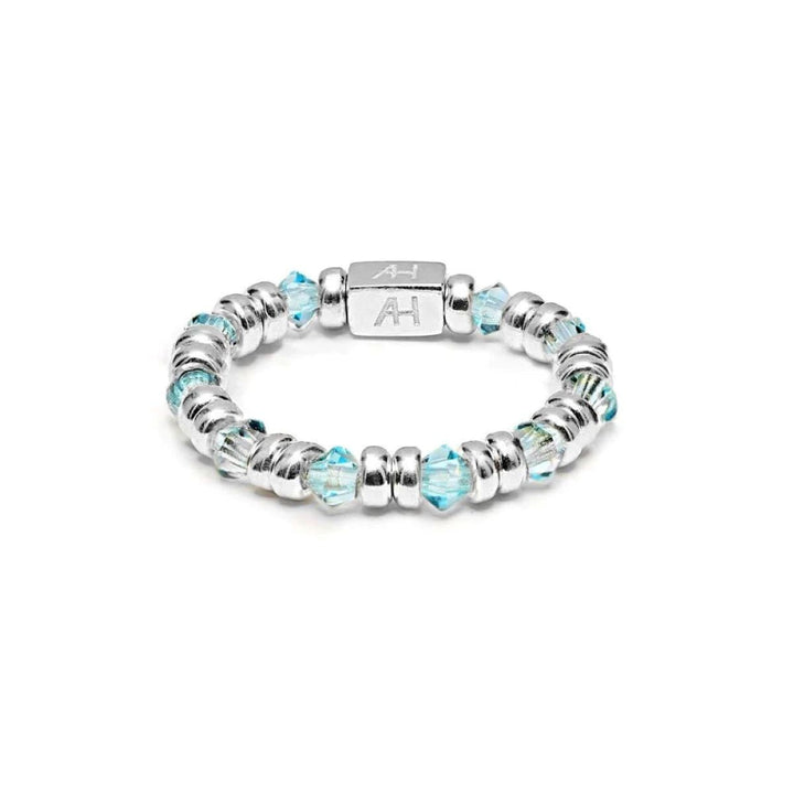 Niche Jewellery Annie Haak Joy ring featuring sky-blue crystals and 925 sterling silver beads with an AH logo charm.