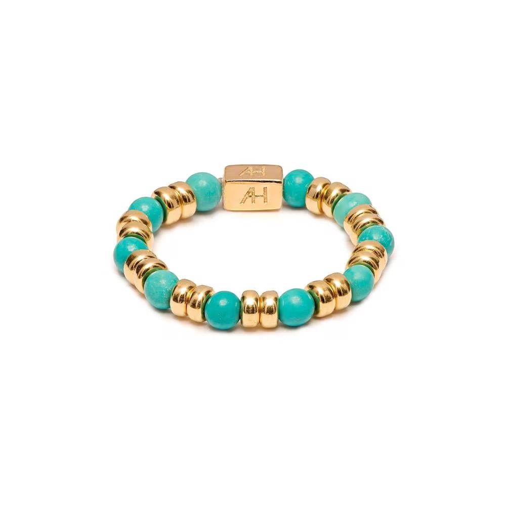 Niche Jewellery Annie Haak Joy stretch ring with turquoise howlite beads and gold-plated sterling silver accents.