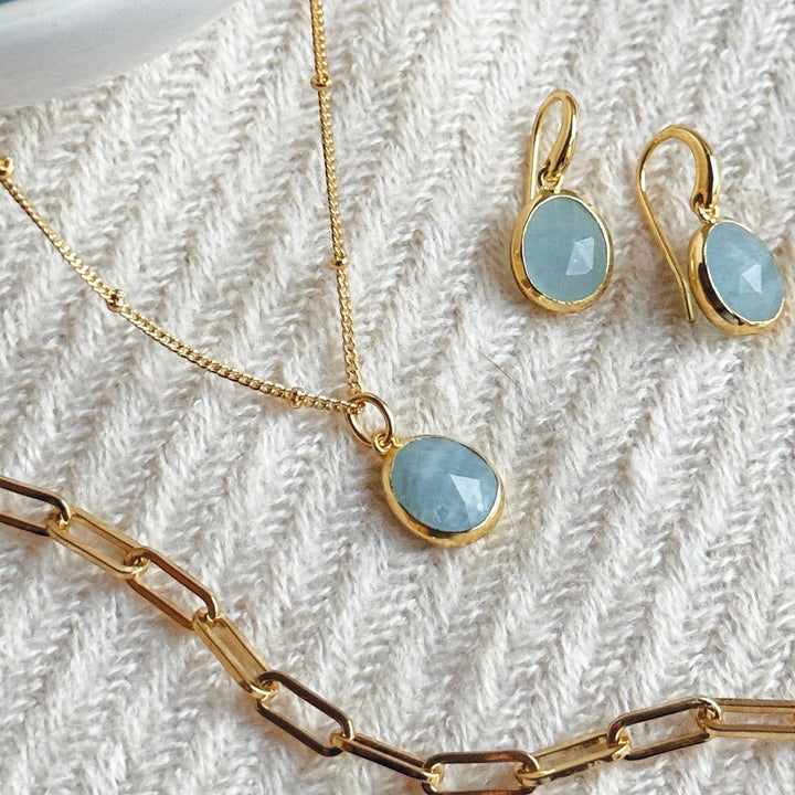Niche Jewellery Sarah Alexander aquamarine pendant necklace and matching earrings on 18ct gold plated bobble chain