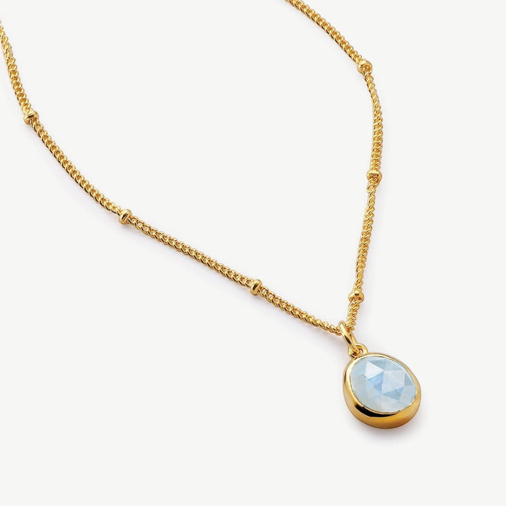 Niche Jewellery Sarah Alexander Aegean necklace featuring a pale blue aquamarine pendant on an 18ct gold bobble chain.