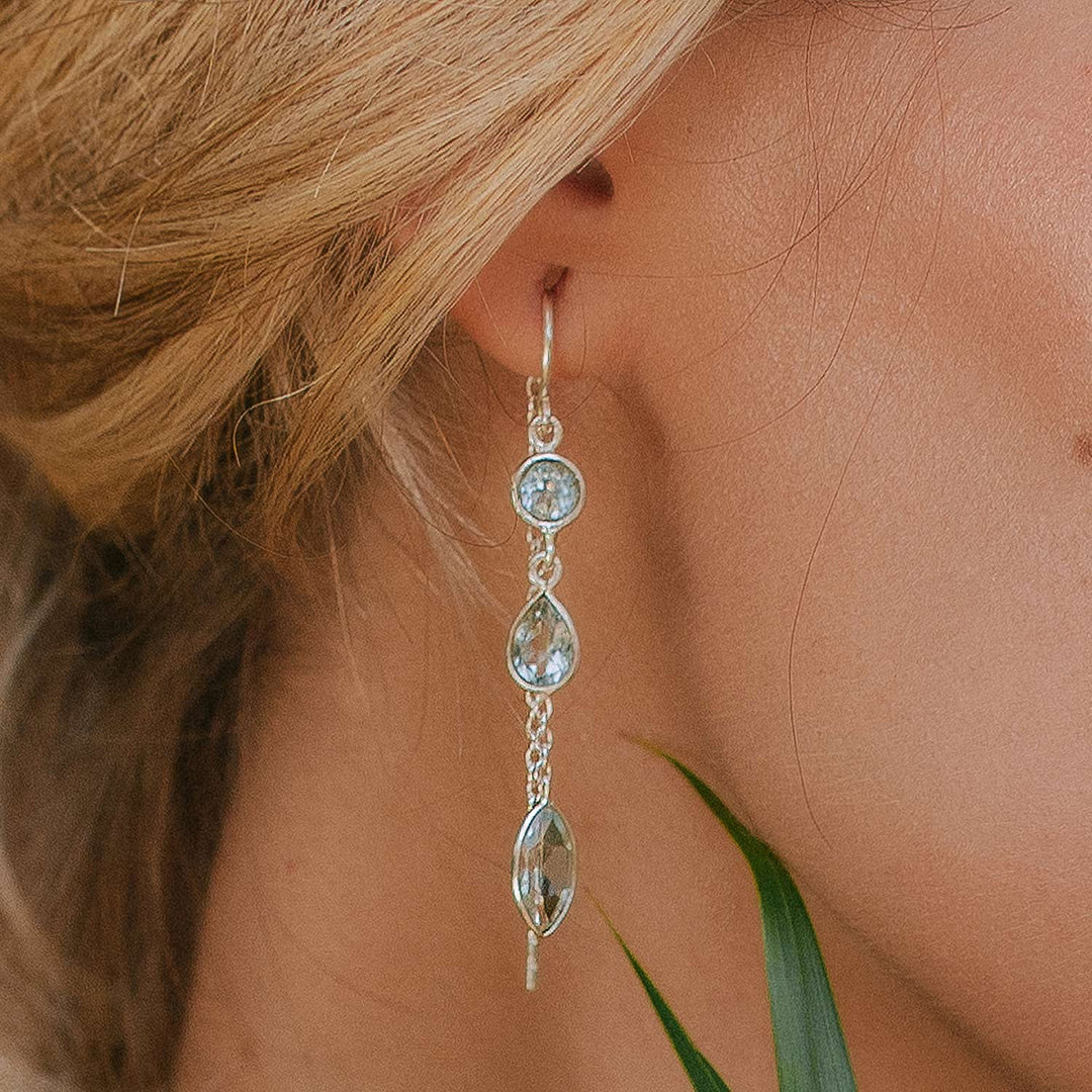 Niche Jewellery Charlotte's Web Azura sterling silver threader earrings featuring blue topaz stones on a fine chain