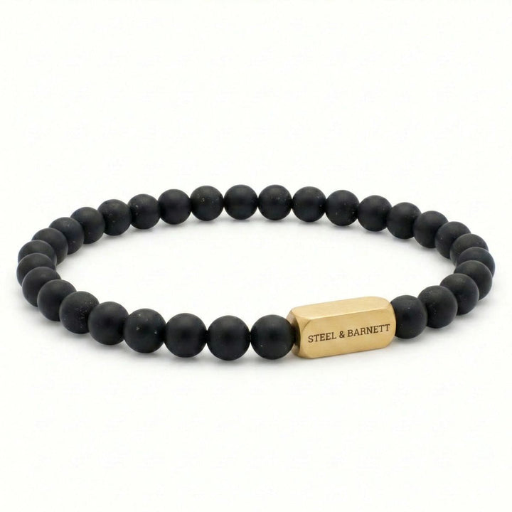 Niche Jewellery Steel & Barnett 6mm black onyx bead bracelet with a brushed 18K gold plated stainless steel accent.