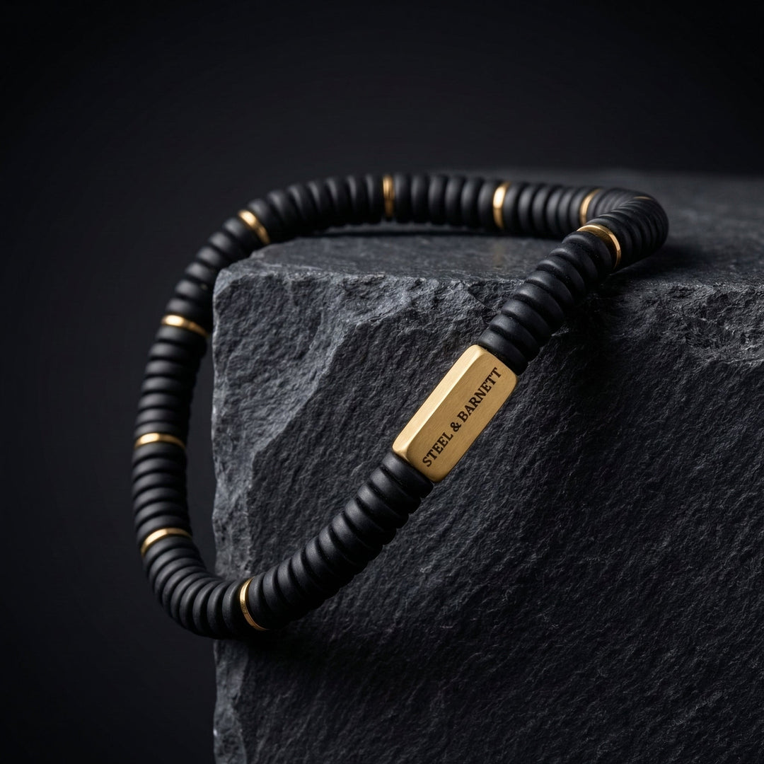 Niche Jewellery Steel & Barnett matte black onyx disc stretch bracelet with 18K gold-plated stainless steel accents.