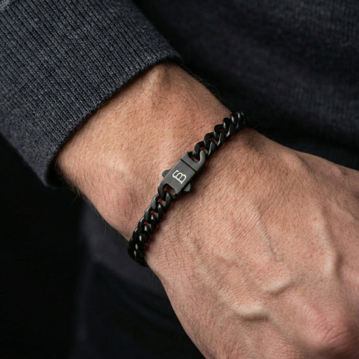 Niche Jewellery Steel & Barnett matte black stainless steel link chain bracelet on a man's wrist