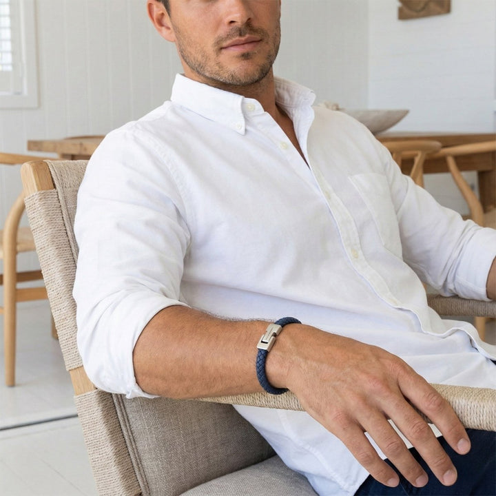 Niche Jewellery Steel & Barnett denim blue braided nappa leather bracelet with stainless steel clasp on a man's wrist