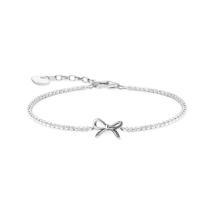 Niche Jewellery Sterling silver bracelet with bow motif and white zirconia stones. Adjustable chain.