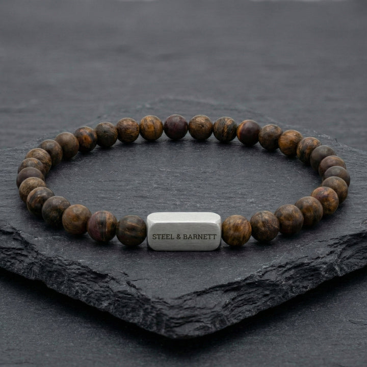 Niche Jewellery Steel & Barnett 6mm matte bronzite bead bracelet with a brushed stainless steel logo accent bead.