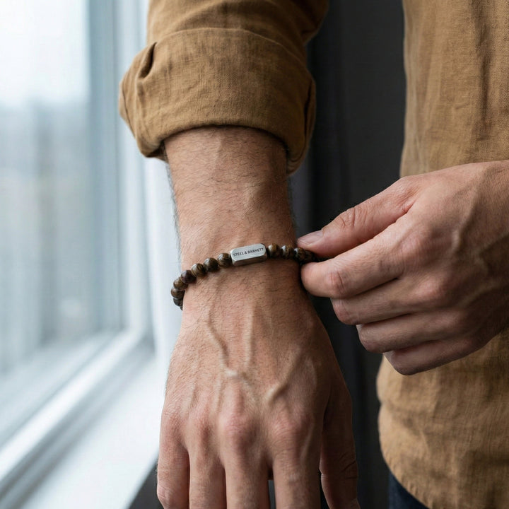 Niche Jewellery Steel & Barnett matte bronzite bead bracelet with stainless steel accent on a man's wrist