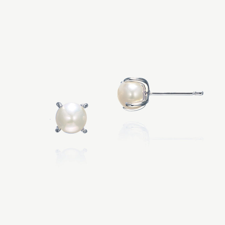 Niche Jewellery Ivory & Co Cairo stud earrings featuring ivory manmade pearls in a rhodium-plated modern setting.