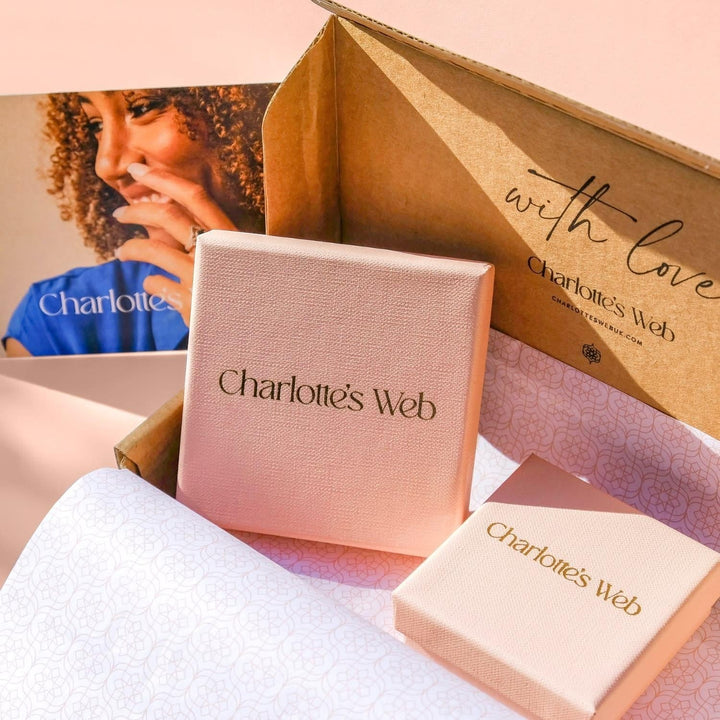 Niche Jewellery Charlotte's Web branded pink gift boxes for a silver stacking bangle inside a shipping package