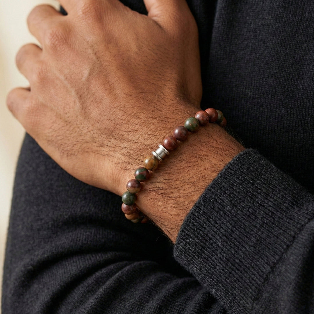 Niche Jewellery Steel & Barnett 8mm Cherry Creek Jasper beaded bracelet with stainless steel accent on a man's wrist.