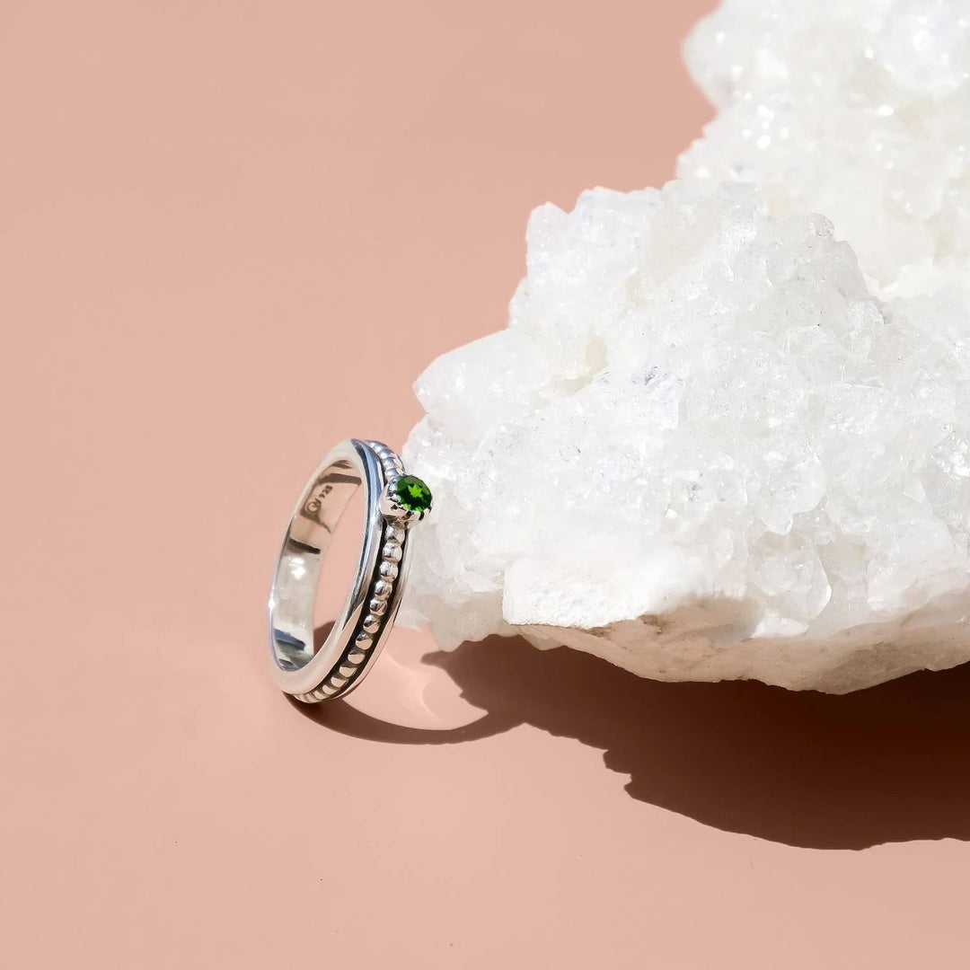 Niche Jewellery Charlotte's Web Lalita sterling silver spinning ring with a deep green chrome diopside gemstone.