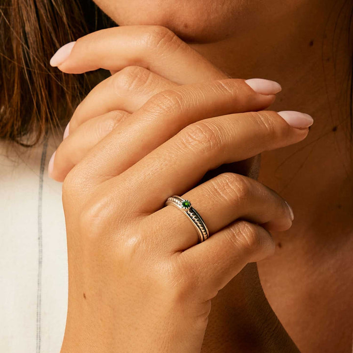 Niche Jewellery Charlotte's Web Lalita sterling silver spinning ring featuring a deep green chrome diopside gemstone.