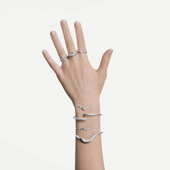 Niche Jewellery Swarovski Classica interlocking sterling silver ring with round-cut white stones on a model's hand