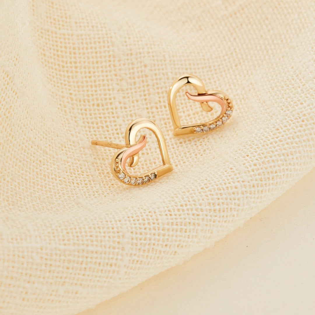Niche Jewellery Clogau Forever Yours 9ct gold heart-shaped kiss stud earrings with sparkling brilliant-cut diamonds.