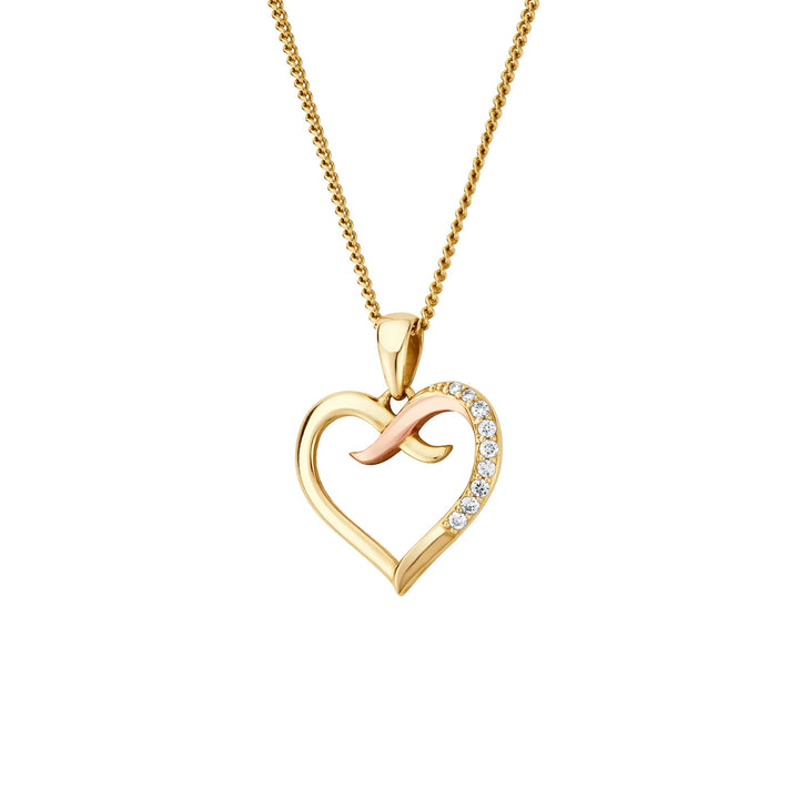 Niche Jewellery Clogau Forever Yours heart pendant in 9ct gold with diamonds and a kiss motif on a delicate chain.
