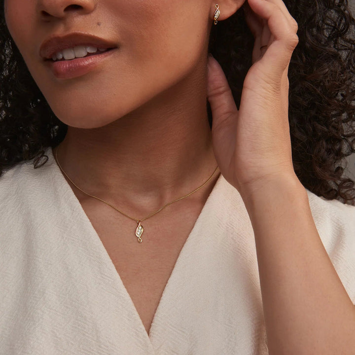 Niche Jewellery Clogau 9ct yellow and rose gold pendant necklace featuring three diamonds on a model