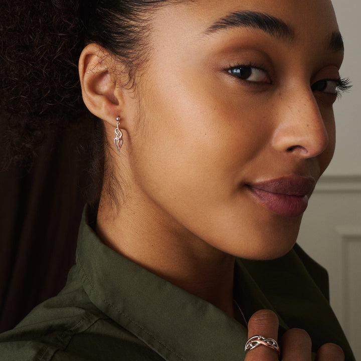 Niche Jewellery Clogau Nature's Wonder sterling silver and rose gold ring and matching drop earrings on a model