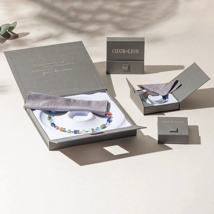 Niche Jewellery Coeur De Lion Princess Pearls bracelet with rainbow Swarovski crystals in gold-tone gift packaging.