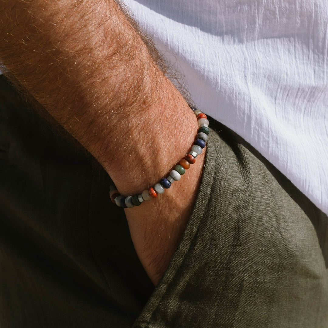 Niche Jewellery Steel & Barnett Cyrus gemstone bracelet with multi-coloured 6mm beads and stainless steel details.