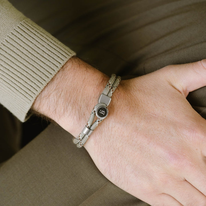 Niche Jewellery Steel & Barnett desert camo rope bracelet with stainless steel clasp on a man's wrist