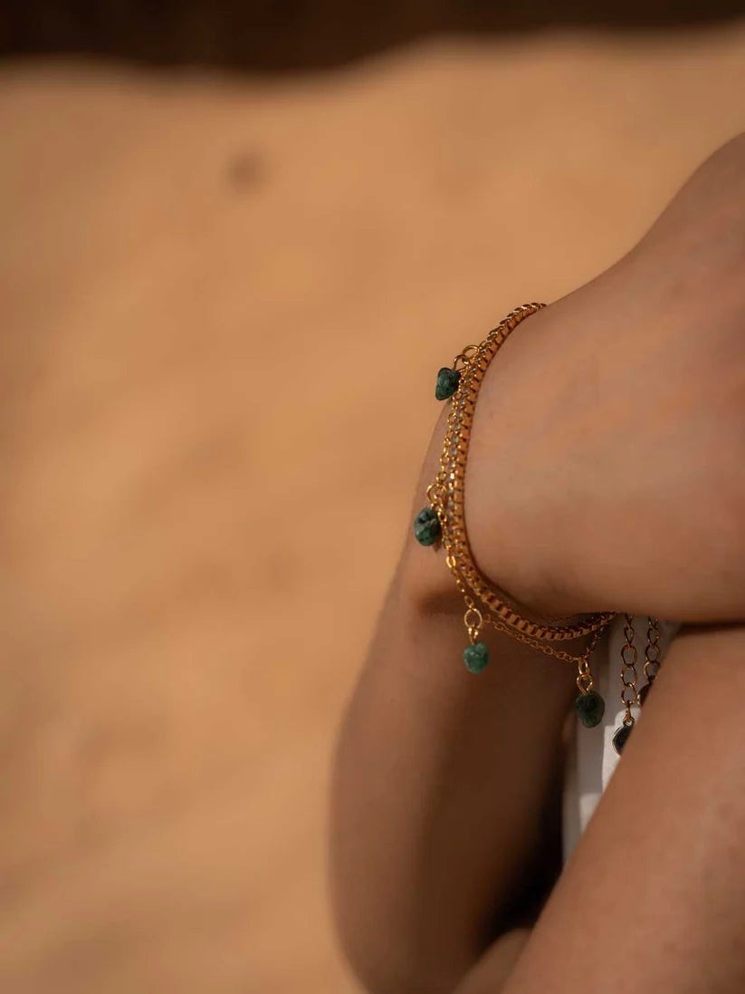 Niche Jewellery Formation Co Mohica bracelet featuring raw-cut emerald charms on an 18k gold plated delicate chain