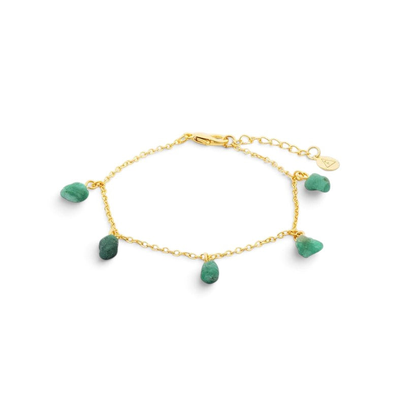 Niche Jewellery Formation Co Mohica charm bracelet featuring raw-cut emerald gemstones on an 18k gold plated sterling silver chain.