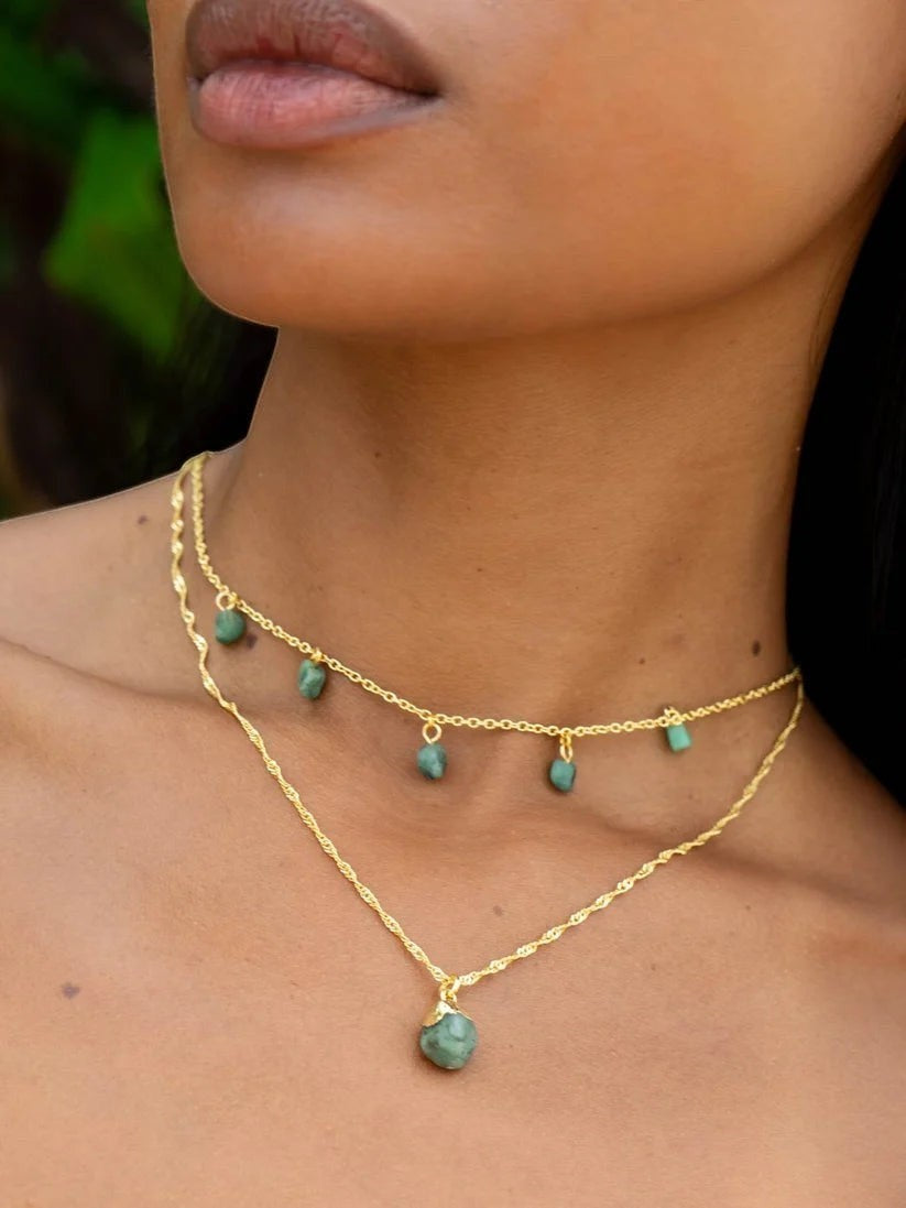 Niche Jewellery Mohica necklace featuring raw-cut emerald stones on an 18k gold plated sterling silver chain