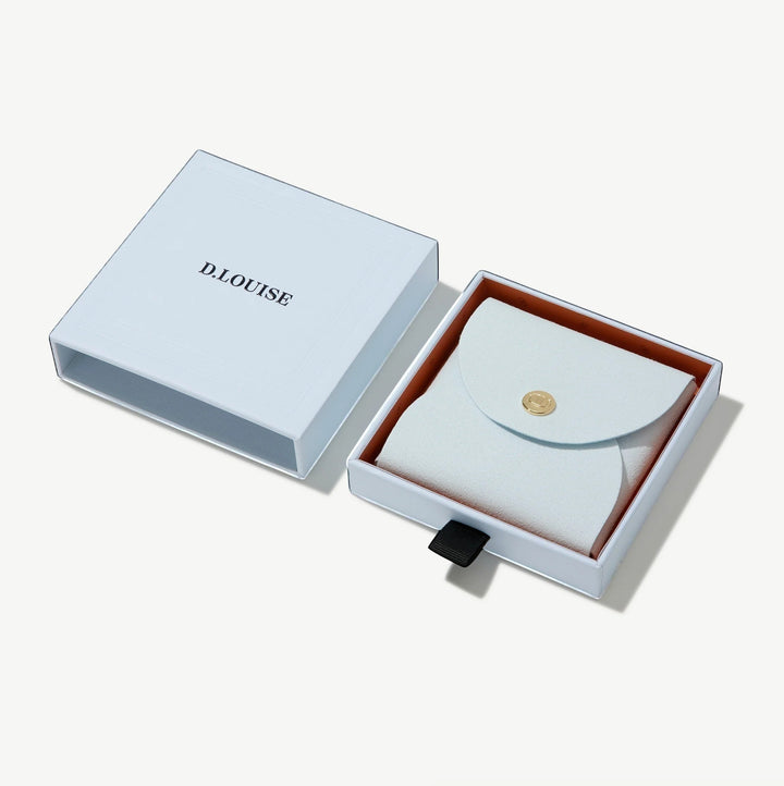 Niche Jewellery branded light blue gift box with a matching pouch for the D.Louise Pavé Clover Gold Pendant Necklace.