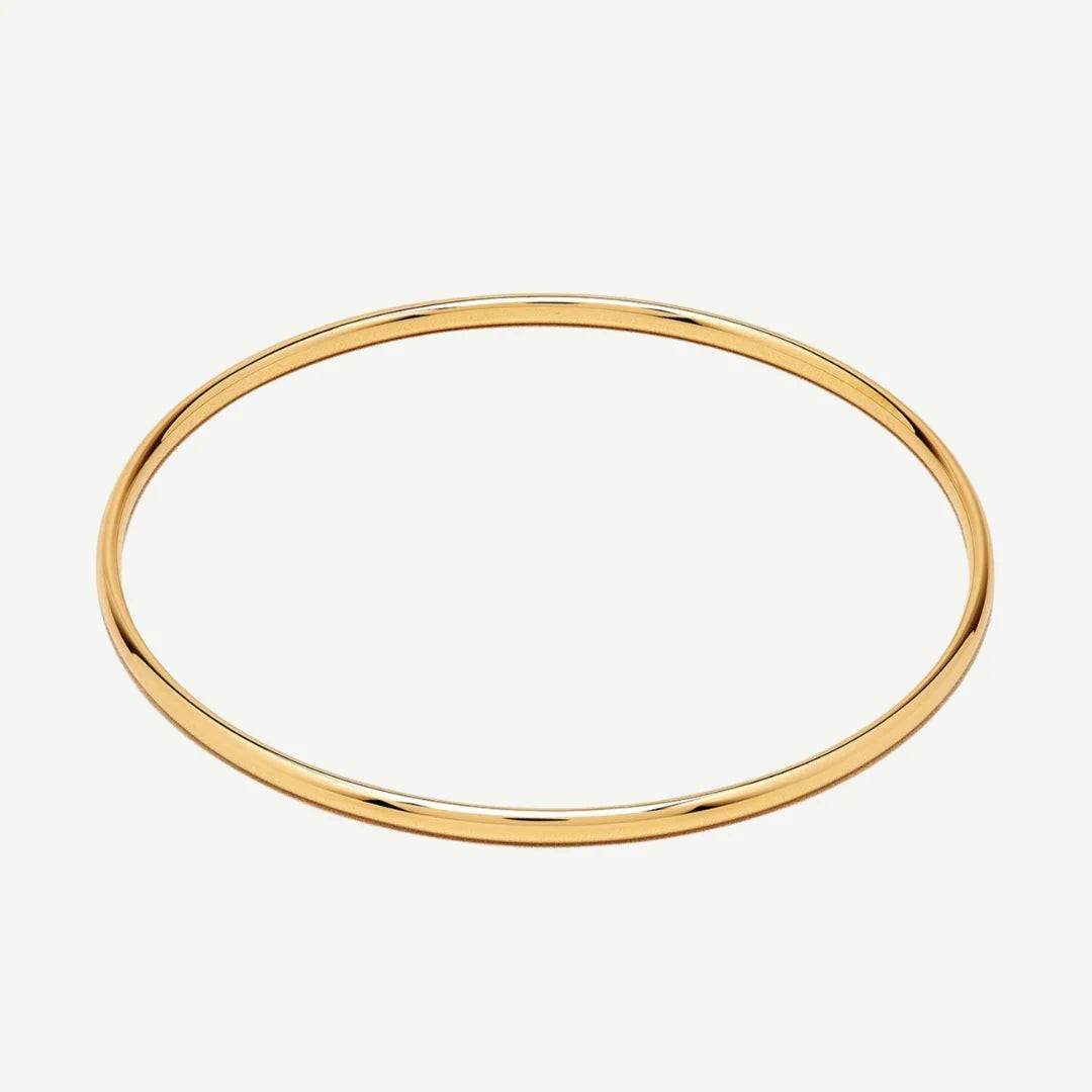 Niche Jewellery classic gold bangle, a versatile and timeless piece for everyday wear or special occasions. Water-resistant.