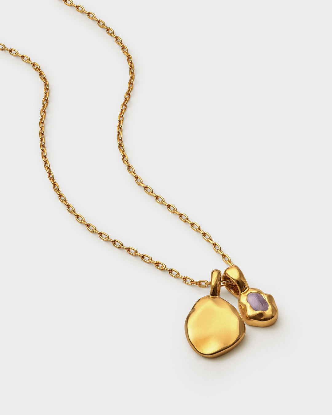 Niche Jewellery Katie Loxton February birthstone necklace featuring a purple stone and gold charm on a fine chain.