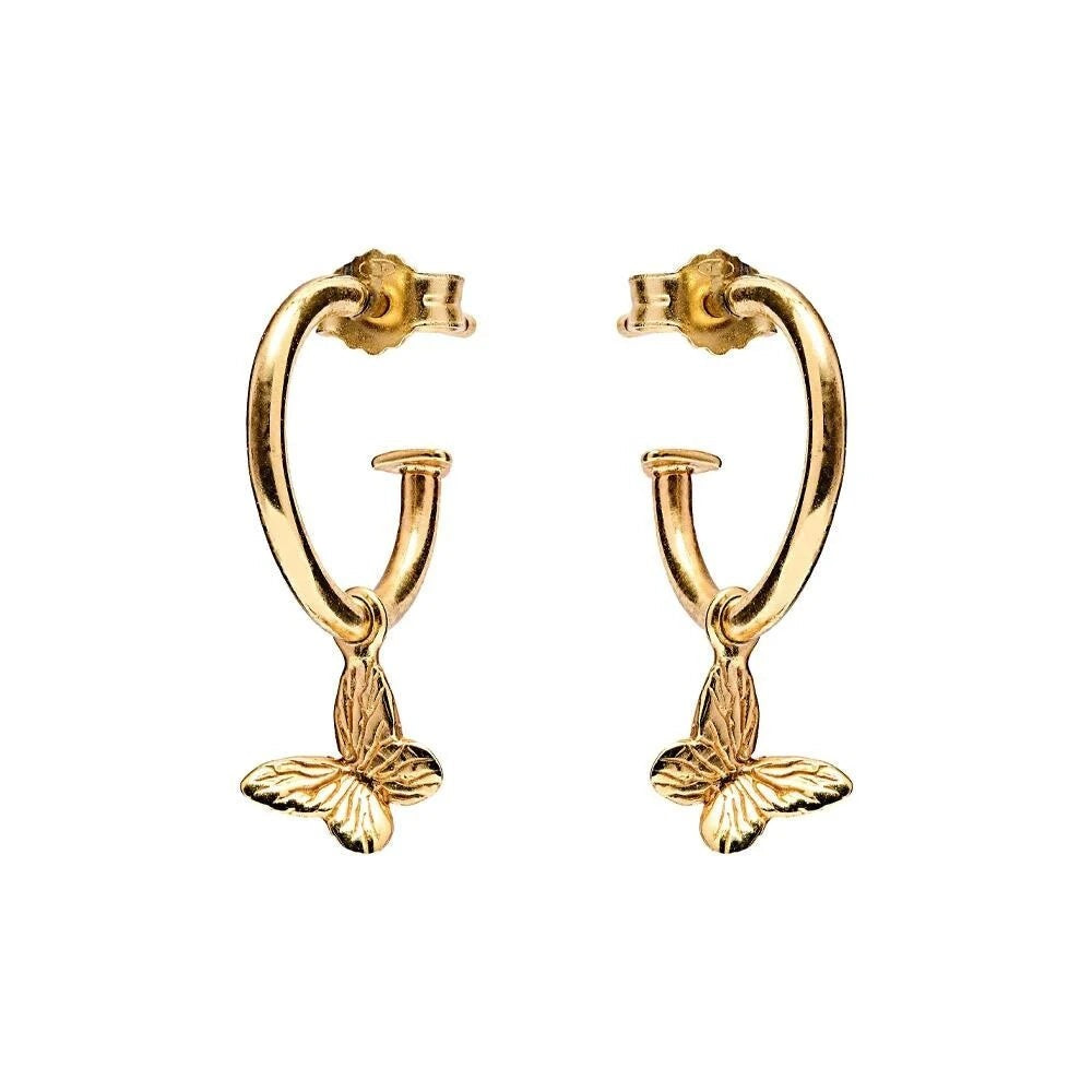 Niche Jewellery Annie Haak gold-plated silver hoop earrings featuring dainty butterfly charms for a delicate look.