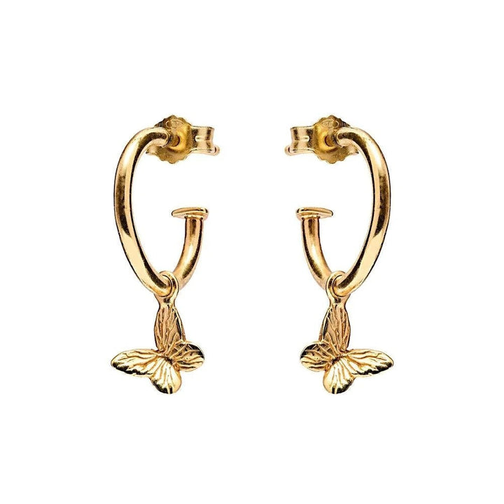 Niche Jewellery Annie Haak gold-plated silver hoop earrings featuring dainty butterfly charms for a delicate look.