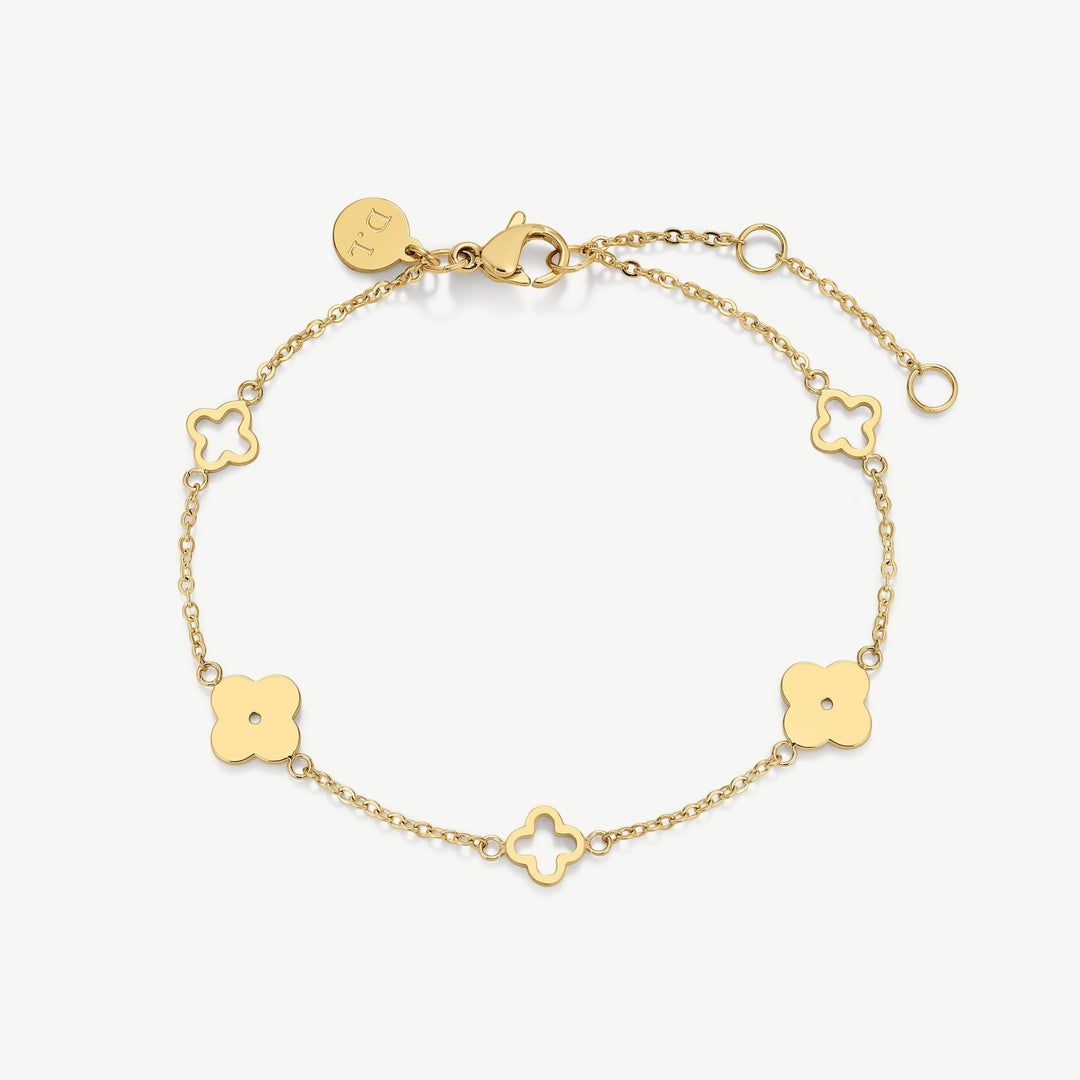 Niche Jewellery gold multi clover bracelet with fine cut-out details and solid clover accents, made from stainless steel.