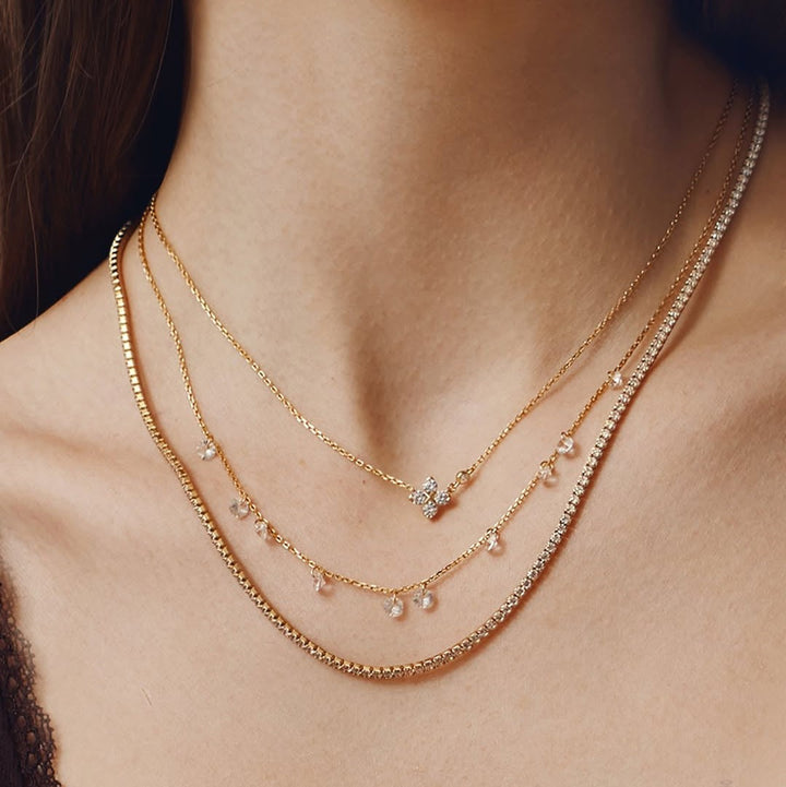 Niche Jewellery Ania Haie gold-plated clover necklace with cubic zirconia layered with delicate crystal chains