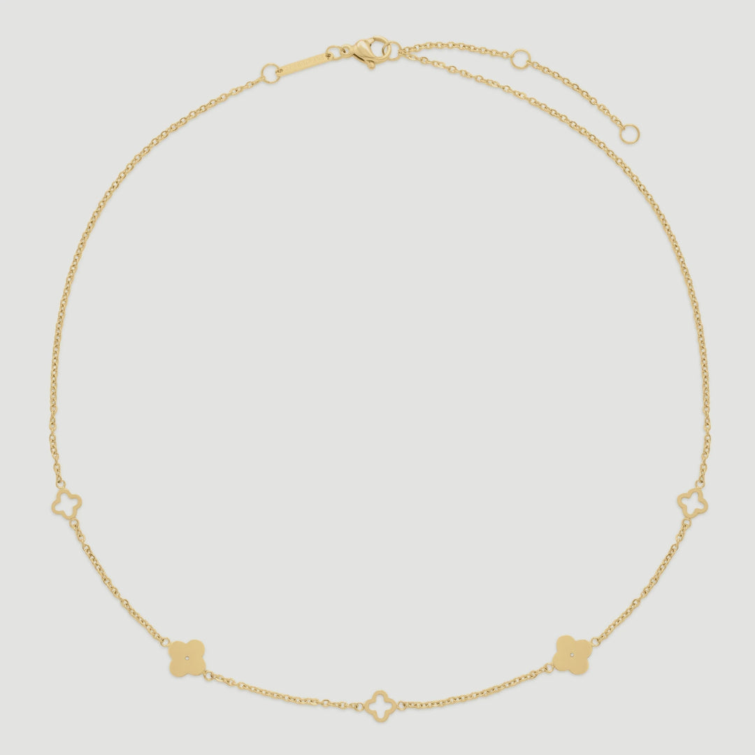 Niche Jewellery D.Louise gold clover necklace in tarnish-free stainless steel with delicate cut-out clover charms.