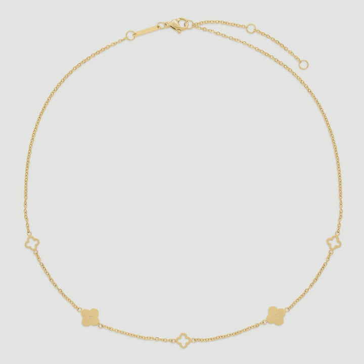 Niche Jewellery D.Louise gold clover necklace in tarnish-free stainless steel with delicate cut-out clover charms.