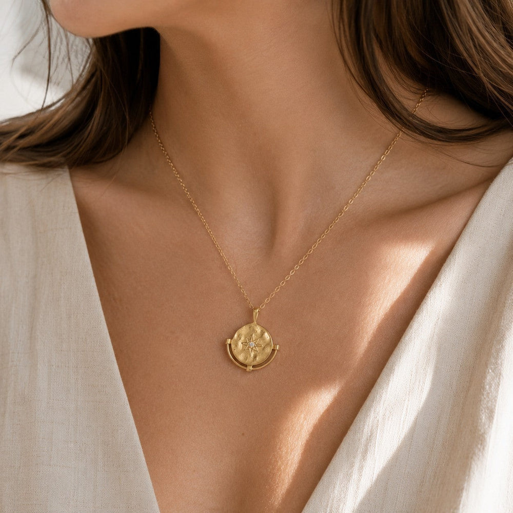 Niche Jewellery Formation Co Cosmic Diamante necklace in 18k gold plated sterling silver with a starburst pendant on a fine chain.