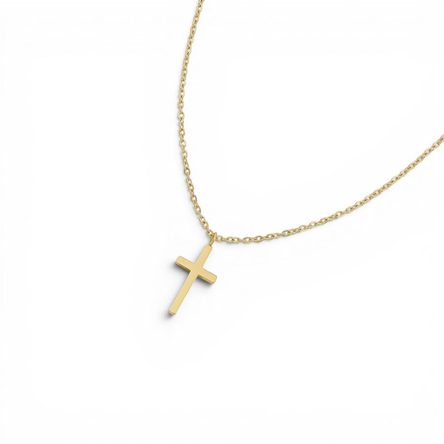 Niche Jewellery D.Louise gold cross pendant necklace on a fine chain, made from waterproof and tarnish-free stainless steel.