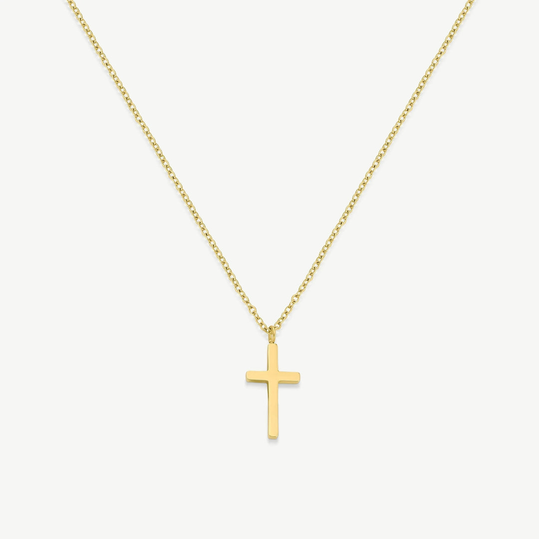 Niche Jewellery D.Louise gold cross pendant necklace on a fine chain, crafted from waterproof stainless steel.