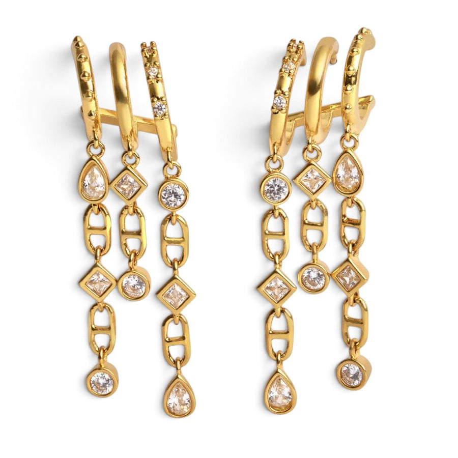 Niche Jewellery Katie Loxton gold-tone waterproof drop earrings featuring sparkling crystal charms and chain links.