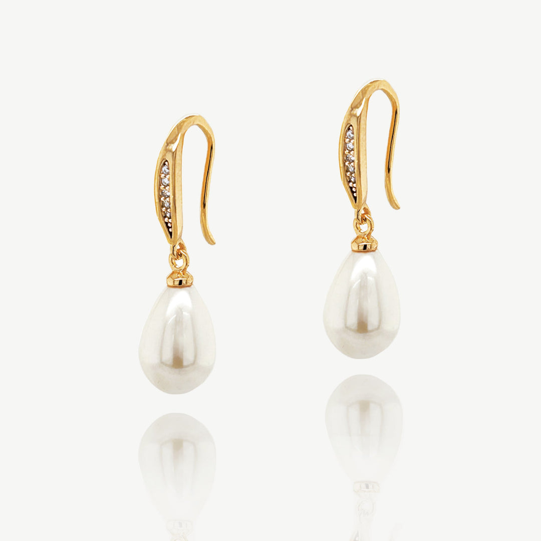 Niche Jewellery Ivory & Co gold drop earrings featuring a pave crystal top and a classic white pearl drop.