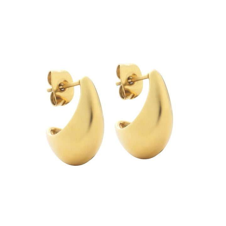 Niche Jewellery D. Louise mini gold hoop earrings with a curved, modern design. Waterproof and tarnish-free.